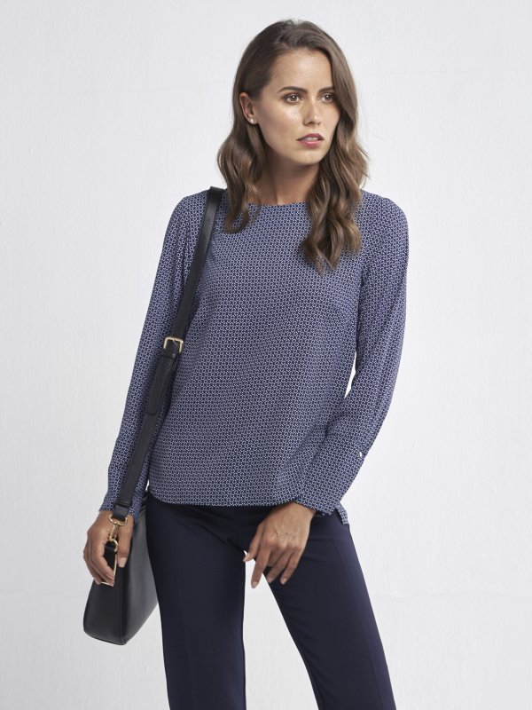 Blouses, Becky, Imperial: Classically styled , long sleeve , boxy top with a curved hem and wide cuff.